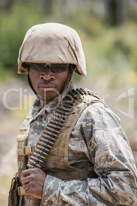 Military soldier standing with ammunition