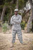 Military soldier standing with arms crossed