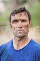 Portrait of determined man standing during obstacle course