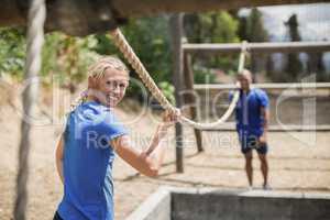 Fit man and woman practicing during obstacle course