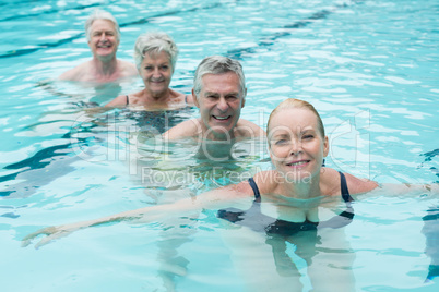 Swimmers swimming in pool