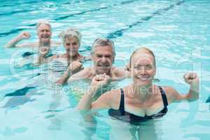 Swimmers enjoying in swimming pool