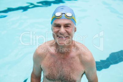 Senior man swimming in pool