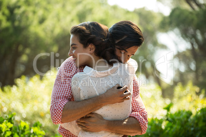 Affectionate couple embracing at park