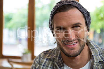 Portrait of smiling man in coffee shop