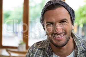 Portrait of smiling man in coffee shop