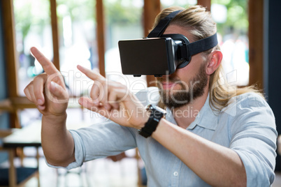 Man wearing virtual glasses in coffee shop