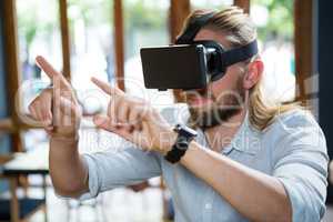 Man wearing virtual glasses in coffee shop