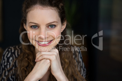Portrait of beautiful woman with brown hair in coffee shop