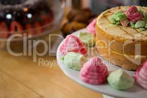 Cake served on plate in coffee house