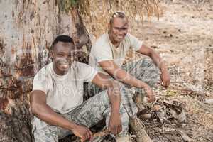Portrait of military soldiers relaxing during obstacle training