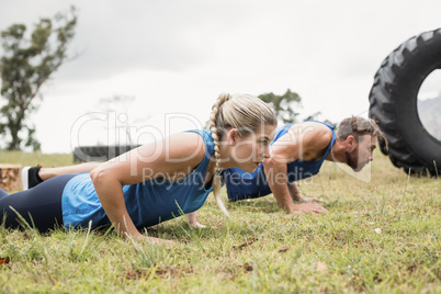 Fit people performing pushup exercise