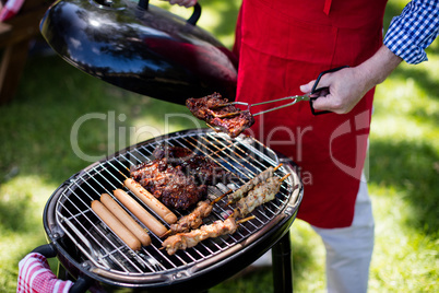 Man barbequing in the park