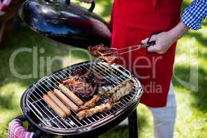 Man barbequing in the park