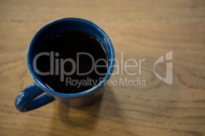 Cup of coffee on table in cafeteria