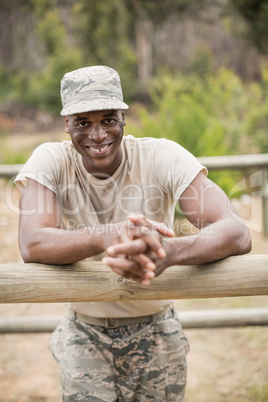 Military man standing during obstacle course in boot camp