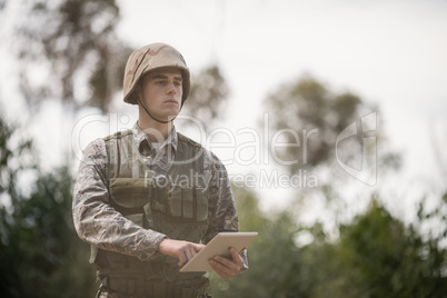 Military soldier using digital tablet