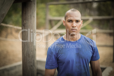 Portrait of determined man standing during obstacle course Portrait of determined man standing during obstacle course