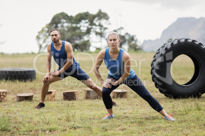 Fit people performing stretching exercise