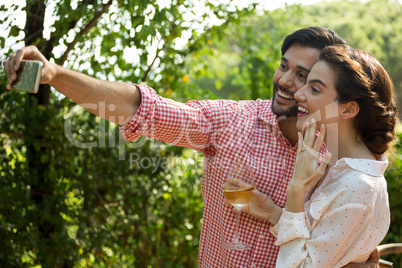 Couple taking selfie at park