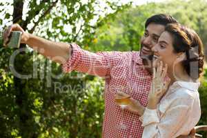 Couple taking selfie at park