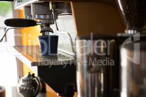 Machine making cup of coffee