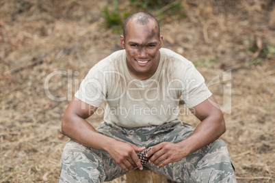 Military soldier relaxing during obstacle training