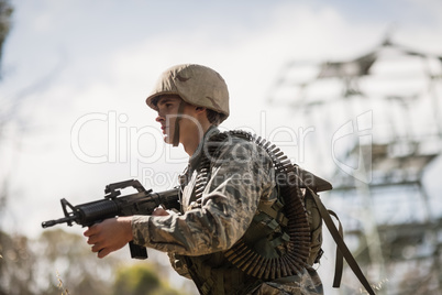 Military soldier standing with a rifle