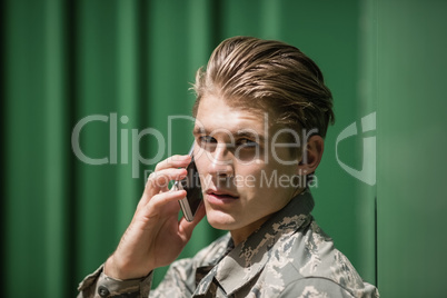 Portrait of military soldier talking on mobile phone