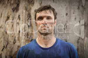 Portrait of determined man standing during obstacle course