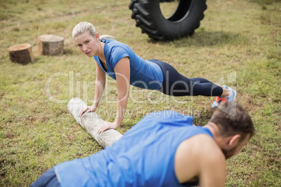 Fit people performing pushup exercise