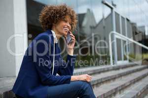 Businesswoman talking on mobile phone in the premises