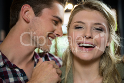 Cheerful woman with loving man in coffee shop