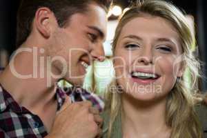 Cheerful woman with loving man in coffee shop