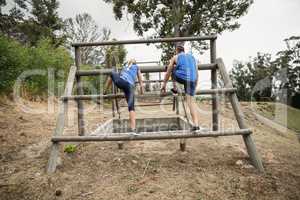 People jumping over the hurdles during obstacle course