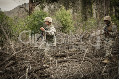 Military soldiers during training exercise with weapon