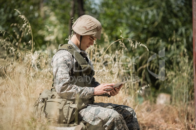 Military soldier using digital tablet