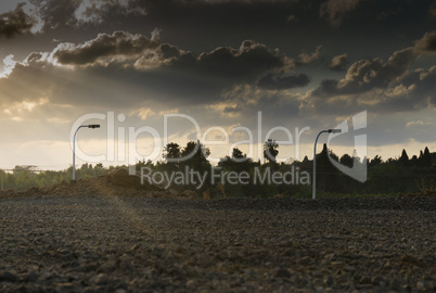 Wide angle shot of dramatic sunset with flare and godrays near Herzliya Pituah district