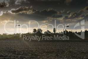 Wide angle shot of dramatic sunset with flare and godrays near Herzliya Pituah district