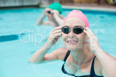 Portrait of mature woman swimming in pool