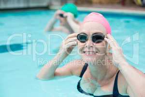 Portrait of mature woman swimming in pool