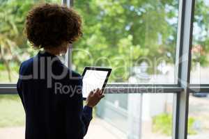 Businesswoman using digital tablet at conference centre