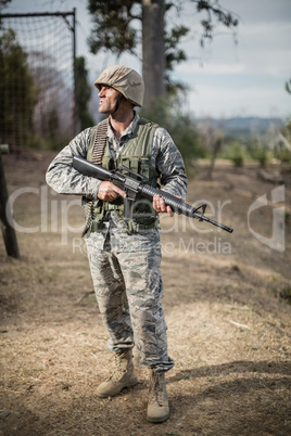 Military soldier during training exercise with weapon