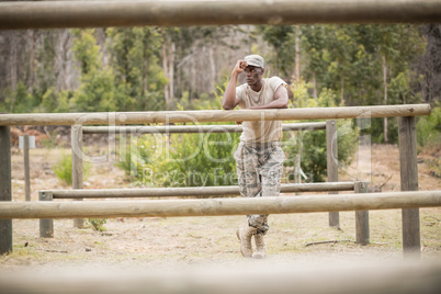 Military man standing during obstacle course in boot camp