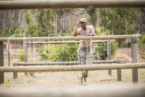 Military man standing during obstacle course in boot camp