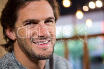 Portrait of man smiling in coffee shop