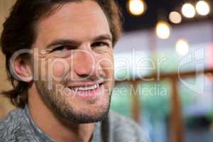 Portrait of man smiling in coffee shop