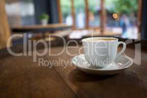 Cup of coffee on wooden table