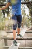 Fit woman during obstacle course training