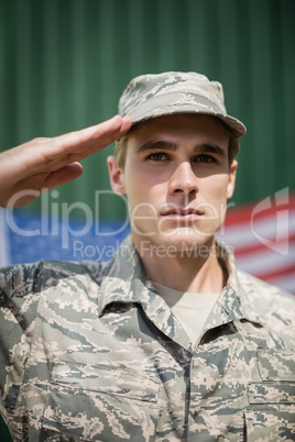Portrait of military soldier giving salute